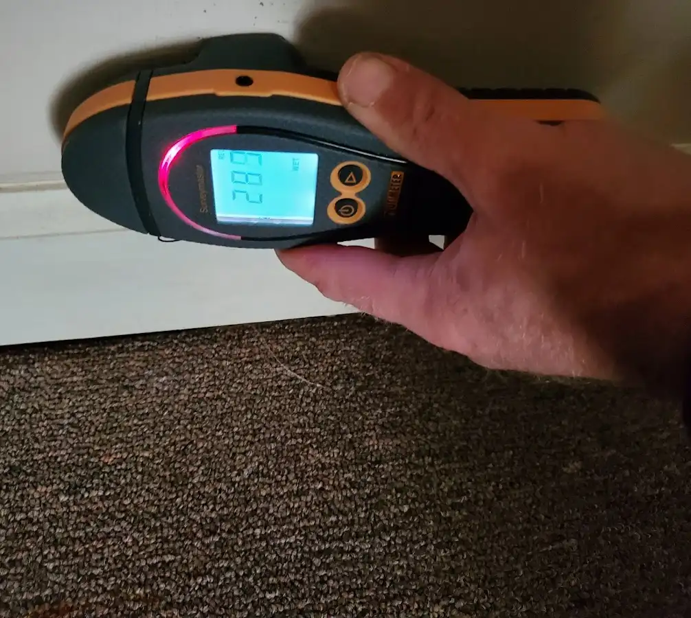 Moisture detection at baseboard during Storm Damage Restoration in Skidaway Island
